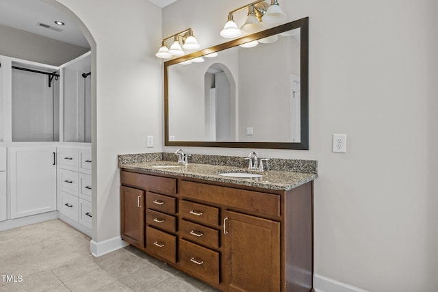 111 Court Jester Way, Morrisville, NC 27560 - bathroom with double vanity and tile patterned floors