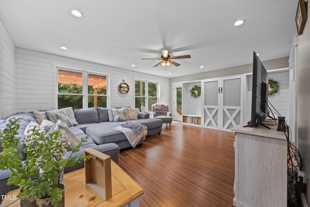 1128 Old Stage Rd S, Erwin, NC 28339 - living room with ceiling fan, plenty of natural light, recessed lighting, wood finished floors, and wooden walls