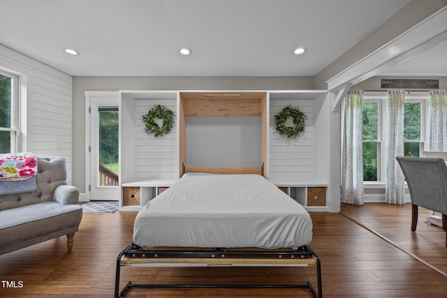 1128 Old Stage Rd S, Erwin, NC 28339 - bedroom featuring wood-type flooring, recessed lighting, and wooden walls