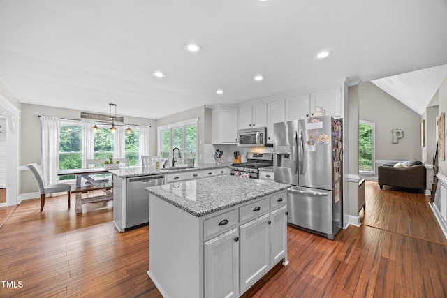 1128 Old Stage Rd S, Erwin, NC 28339 - kitchen featuring stainless steel appliances, a peninsula, a kitchen island, white cabinetry, and dark wood finished floors