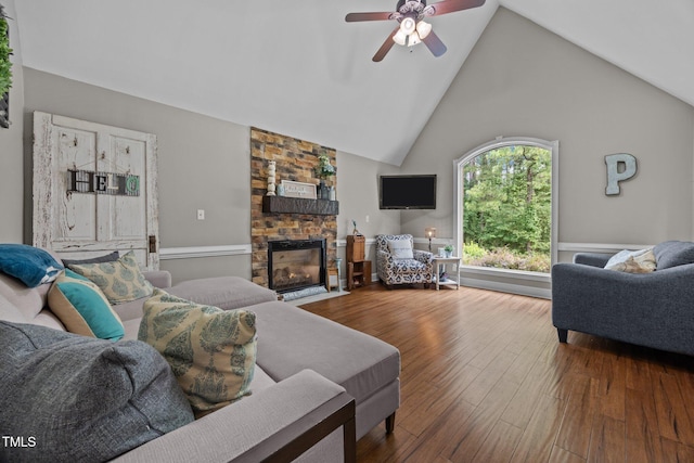 1128 Old Stage Rd S, Erwin, NC 28339 - living area featuring ceiling fan, a fireplace, high vaulted ceiling, and wood finished floors