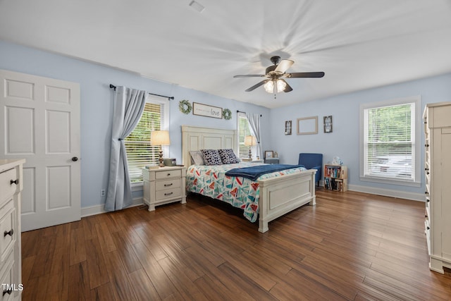 1128 Old Stage Rd S, Erwin, NC 28339 - bedroom featuring dark wood finished floors and a ceiling fan