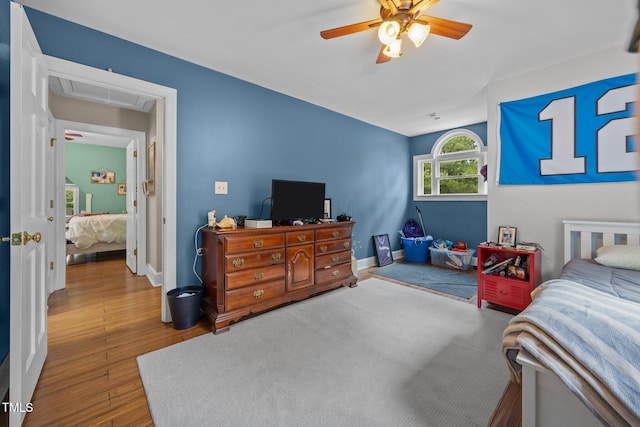 1128 Old Stage Rd S, Erwin, NC 28339 - bedroom with attic access, wood finished floors, and ceiling fan