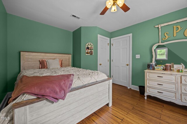 1128 Old Stage Rd S, Erwin, NC 28339 - bedroom with hardwood / wood-style floors and a ceiling fan
