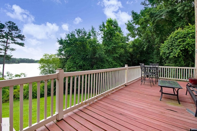 4904 Pebble Beach Cir N, Wilson, NC 27896 - deck with outdoor dining area, a water view, and a yard