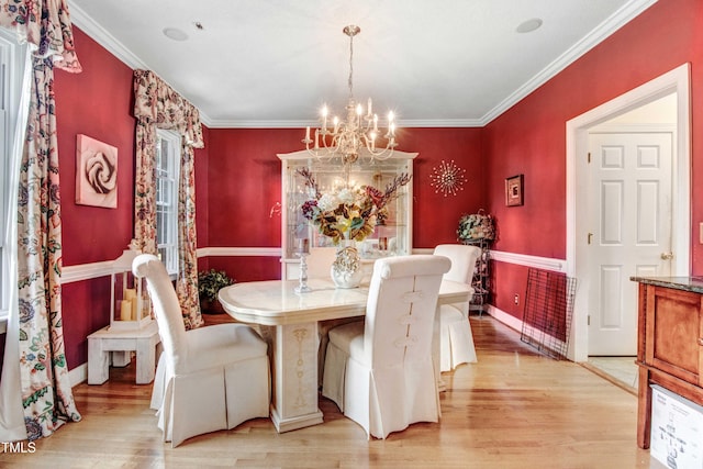 4904 Pebble Beach Cir N, Wilson, NC 27896 - dining room with a chandelier, light wood-style floors, and ornamental molding