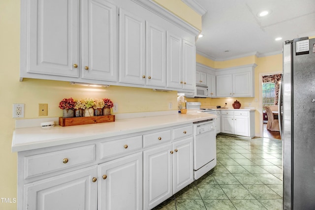 4904 Pebble Beach Cir N, Wilson, NC 27896 - kitchen with white appliances, white cabinetry, ornamental molding, recessed lighting, and light countertops