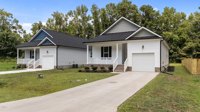 312 E Yukon St, Kenly, NC 27542 - view of front of home with a porch, an attached garage, concrete driveway, and crawl space