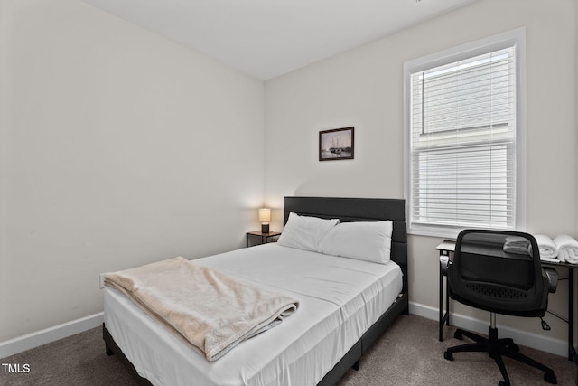 312 E Yukon St, Kenly, NC 27542 - carpeted bedroom with multiple windows and an office area