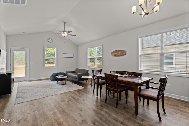 312 E Yukon St, Kenly, NC 27542 - dining area with a chandelier, wood finished floors, ceiling fan, and vaulted ceiling