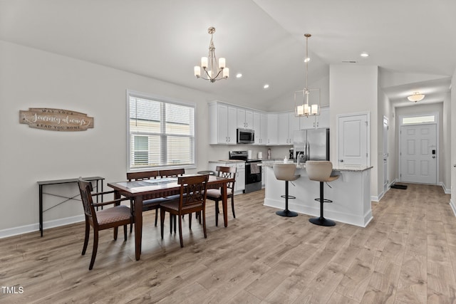 312 E Yukon St, Kenly, NC 27542 - dining area with a chandelier, light wood-style flooring, high vaulted ceiling, and recessed lighting