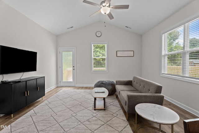 312 E Yukon St, Kenly, NC 27542 - living area with ceiling fan, healthy amount of natural light, light wood-style floors, and vaulted ceiling