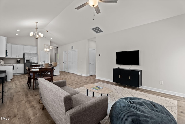 312 E Yukon St, Kenly, NC 27542 - living room featuring a chandelier, ceiling fan, light wood-style flooring, lofted ceiling, and recessed lighting