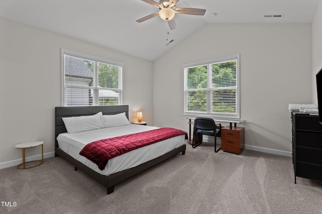 312 E Yukon St, Kenly, NC 27542 - bedroom featuring multiple windows, light carpet, lofted ceiling, and a ceiling fan