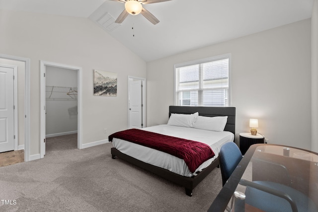 312 E Yukon St, Kenly, NC 27542 - carpeted bedroom featuring lofted ceiling, a walk in closet, and a ceiling fan
