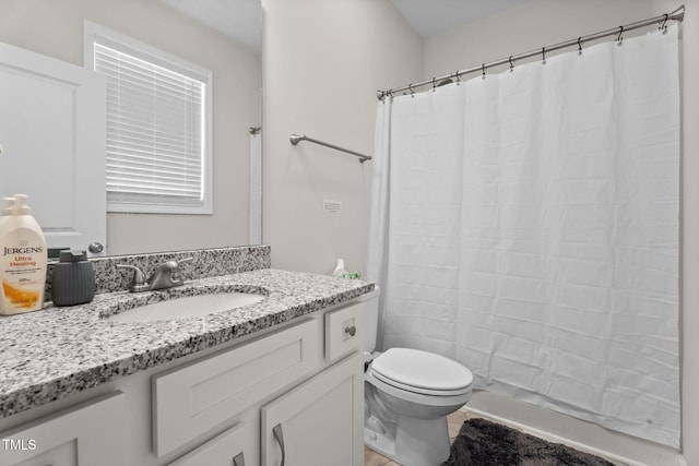 312 E Yukon St, Kenly, NC 27542 - bathroom with vanity and a shower with shower curtain