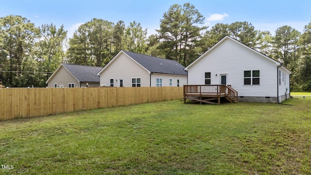 312 E Yukon St, Kenly, NC 27542 - rear view of house with crawl space, a deck, and view of wooded area