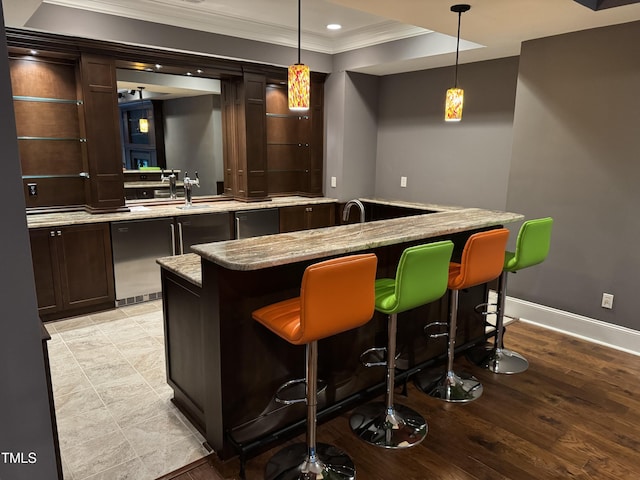 2305 Berteau Dr, Wake Forest, NC 27587 - indoor bar with crown molding, hanging light fixtures, recessed lighting, dishwasher, and light wood finished floors
