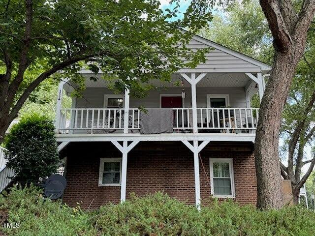114 Drummond Pl, Cary, NC 27511 - back of house featuring a balcony and brick siding