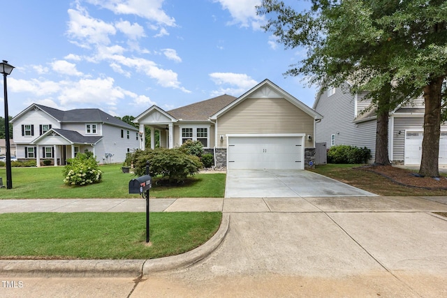 1205 Barnford Mill Rd, Wake Forest, NC 27587 - view of front of property featuring concrete driveway, a front lawn, a garage, and stone siding