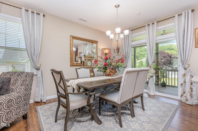 1205 Barnford Mill Rd, Wake Forest, NC 27587 - dining room featuring wood finished floors and a chandelier