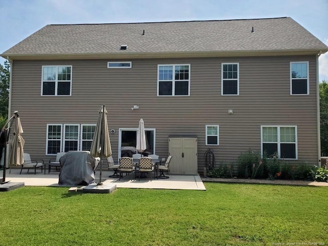 5724 Avera Ln, Holly Springs, NC 27540 - back of house with a patio area and a lawn