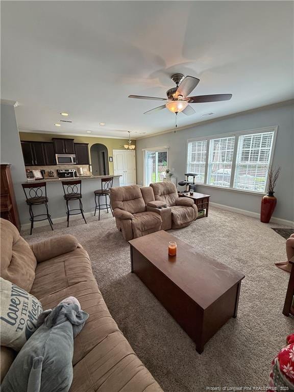 5724 Avera Ln, Holly Springs, NC 27540 - living area featuring carpet, arched walkways, recessed lighting, and ceiling fan