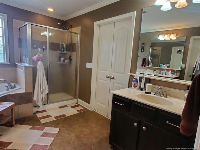 5724 Avera Ln, Holly Springs, NC 27540 - bathroom featuring a chandelier, vanity, a stall shower, a garden tub, and ornamental molding