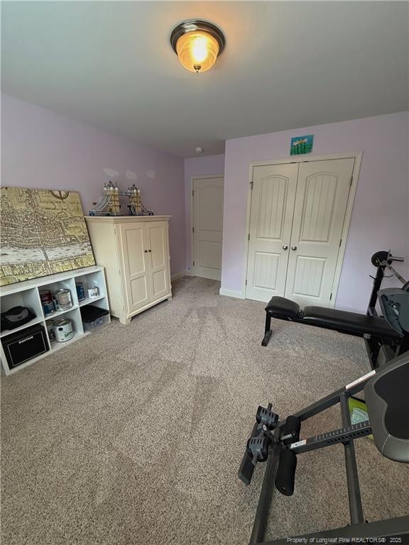 5724 Avera Ln, Holly Springs, NC 27540 - exercise area with light colored carpet and baseboards