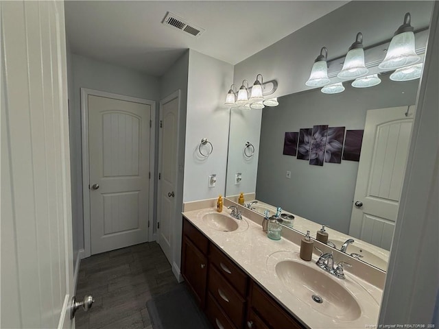 5724 Avera Ln, Holly Springs, NC 27540 - bathroom featuring double vanity and wood finished floors