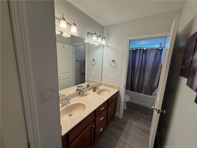5724 Avera Ln, Holly Springs, NC 27540 - full bath with double vanity, shower / bath combo, and wood finished floors