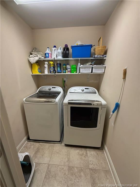 5724 Avera Ln, Holly Springs, NC 27540 - washroom featuring independent washer and dryer and light tile patterned flooring