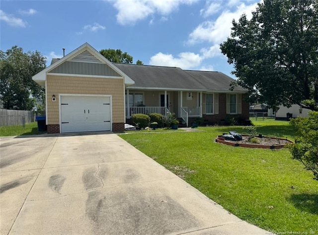 7453 Avila Dr, Fayetteville, NC 28314 - ranch-style home featuring a porch, driveway, and a garage