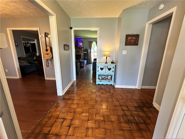 7453 Avila Dr, Fayetteville, NC 28314 - hallway featuring a textured ceiling