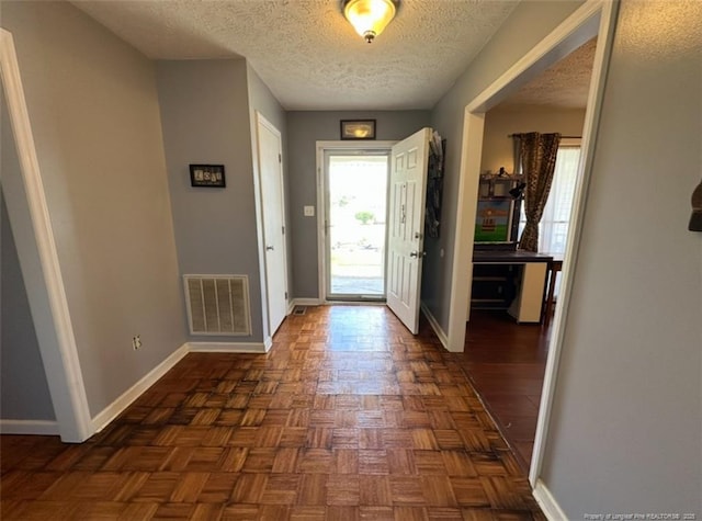 7453 Avila Dr, Fayetteville, NC 28314 - foyer entrance featuring baseboards and a textured ceiling