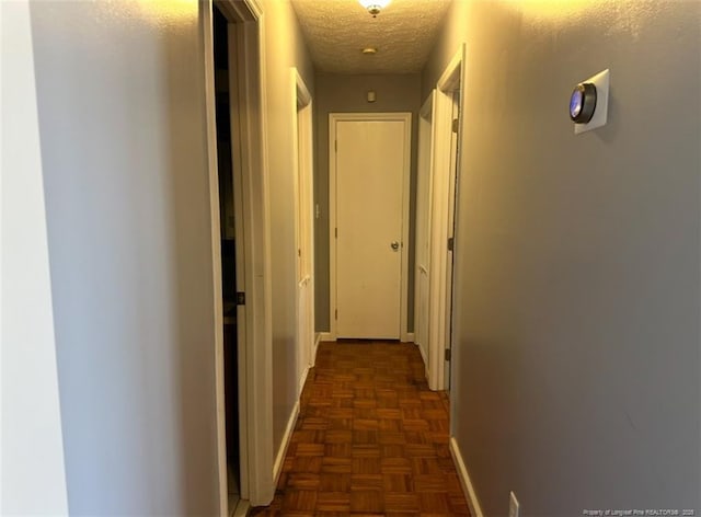 7453 Avila Dr, Fayetteville, NC 28314 - hallway with baseboards and a textured ceiling