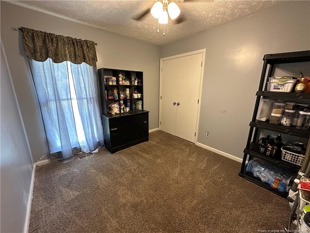 7453 Avila Dr, Fayetteville, NC 28314 - bedroom featuring a textured ceiling, carpet flooring, and ceiling fan