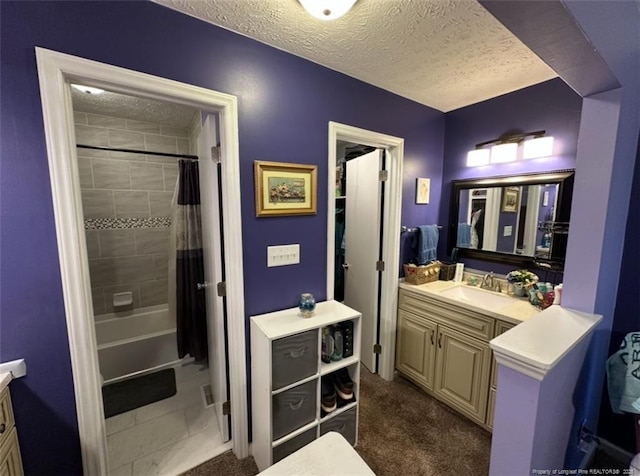 7453 Avila Dr, Fayetteville, NC 28314 - full bathroom featuring vanity, a textured ceiling, and shower / bath combo