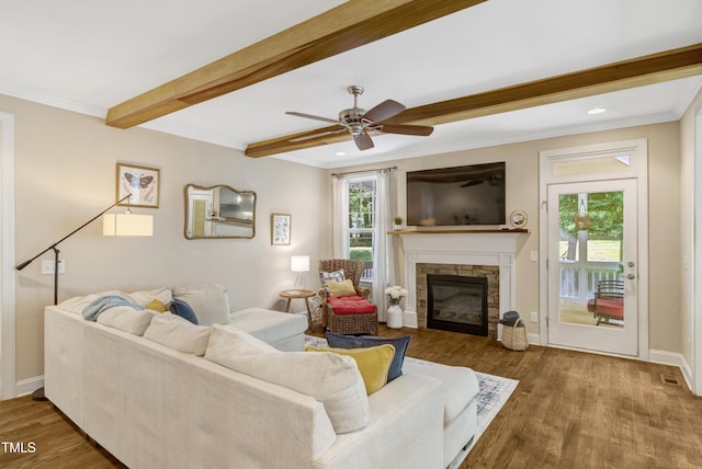 3650 Brooks Bnd, Franklinton, NC 27525 - living area featuring beam ceiling, wood finished floors, a ceiling fan, a stone fireplace, and crown molding