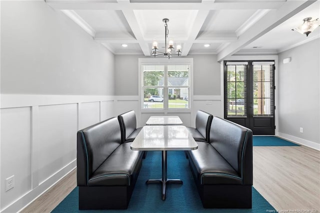 232 Captain Hbr, Sanford, NC 27332 - dining area with a chandelier, wood finished floors, beam ceiling, coffered ceiling, and wainscoting