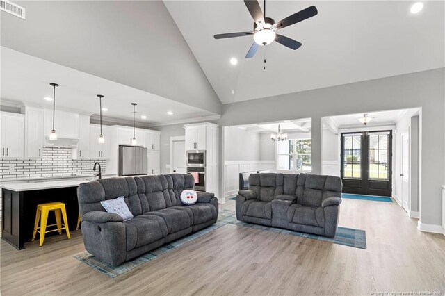 232 Captain Hbr, Sanford, NC 27332 - living room featuring light wood-style flooring, a ceiling fan, recessed lighting, a chandelier, and ornamental molding