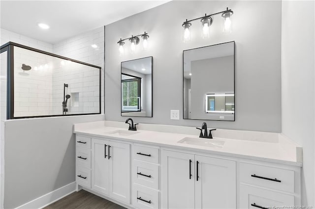 232 Captain Hbr, Sanford, NC 27332 - full bathroom featuring double vanity, a tile shower, and wood finished floors