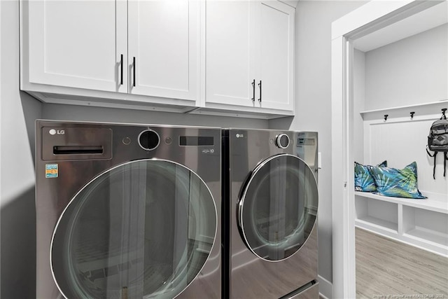 232 Captain Hbr, Sanford, NC 27332 - laundry area with washing machine and clothes dryer, cabinet space, and wood finished floors