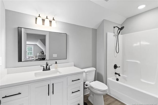 232 Captain Hbr, Sanford, NC 27332 - bathroom featuring vanity, wood finished floors,  shower combination, lofted ceiling, and recessed lighting