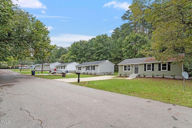 1209 Freeman Dr, Sanford, NC 27330 - view of front facade featuring crawl space, driveway, a front yard, and entry steps