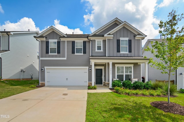 4805 Ozark St, Fuquay Varina, NC 27526 - craftsman-style house with board and batten siding, driveway, a garage, and a front yard