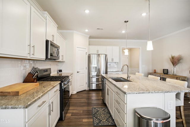 4805 Ozark St, Fuquay Varina, NC 27526 - kitchen featuring appliances with stainless steel finishes, crown molding, a breakfast bar, white cabinets, and decorative backsplash