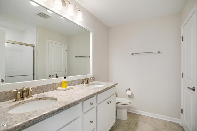 4805 Ozark St, Fuquay Varina, NC 27526 - bathroom featuring double vanity, a shower stall, and tile patterned flooring
