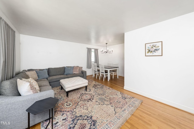 5203 Shady Bluff St, Durham, NC 27704 - living room featuring a chandelier and wood finished floors