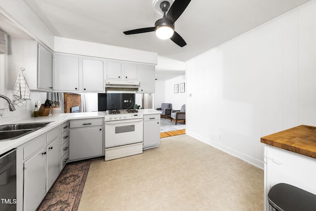 5203 Shady Bluff St, Durham, NC 27704 - kitchen with white gas stove, under cabinet range hood, a ceiling fan, dishwasher, and backsplash